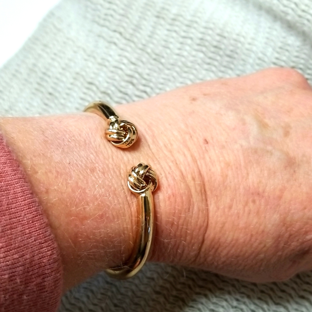 Gold color hinged bracelet